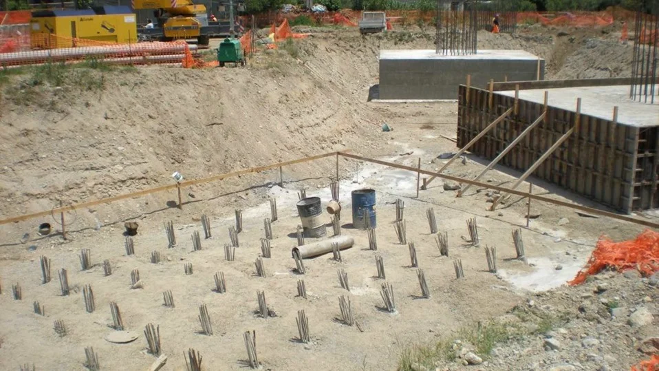 Soil rig in operation with workers