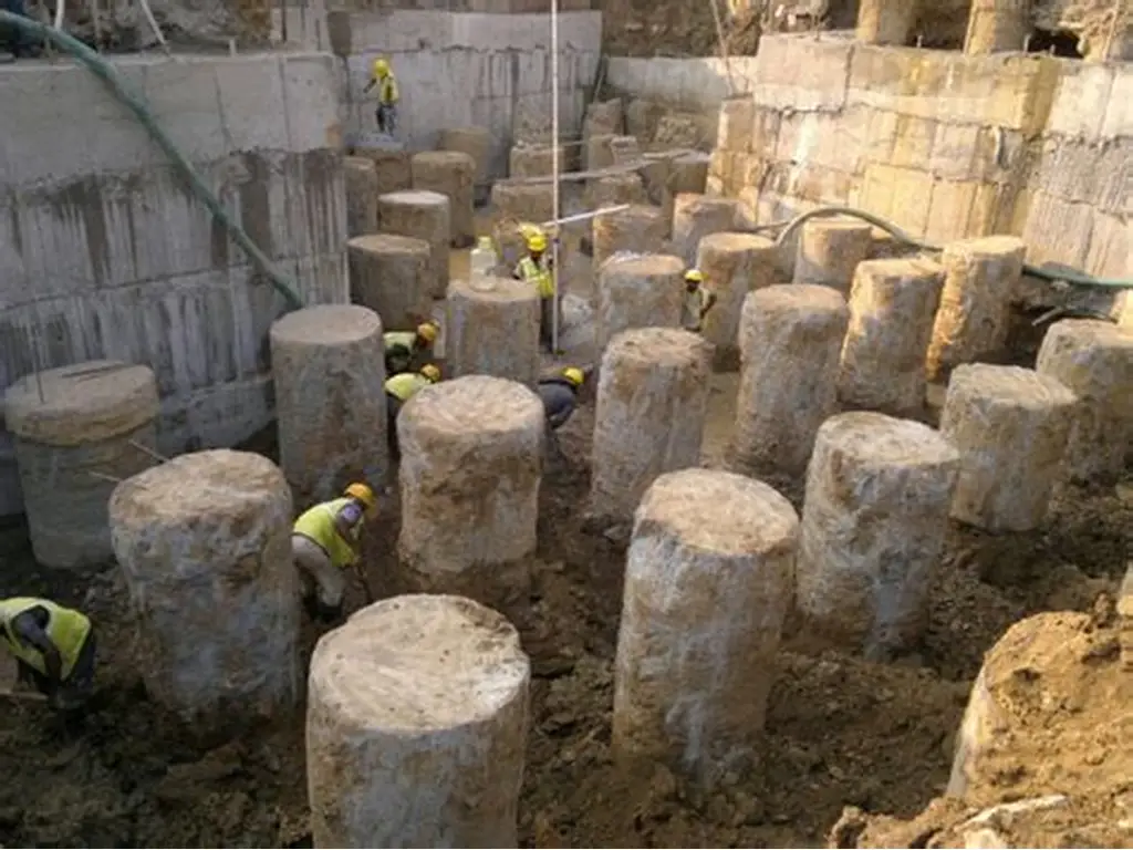 Soil rig in operation with workers