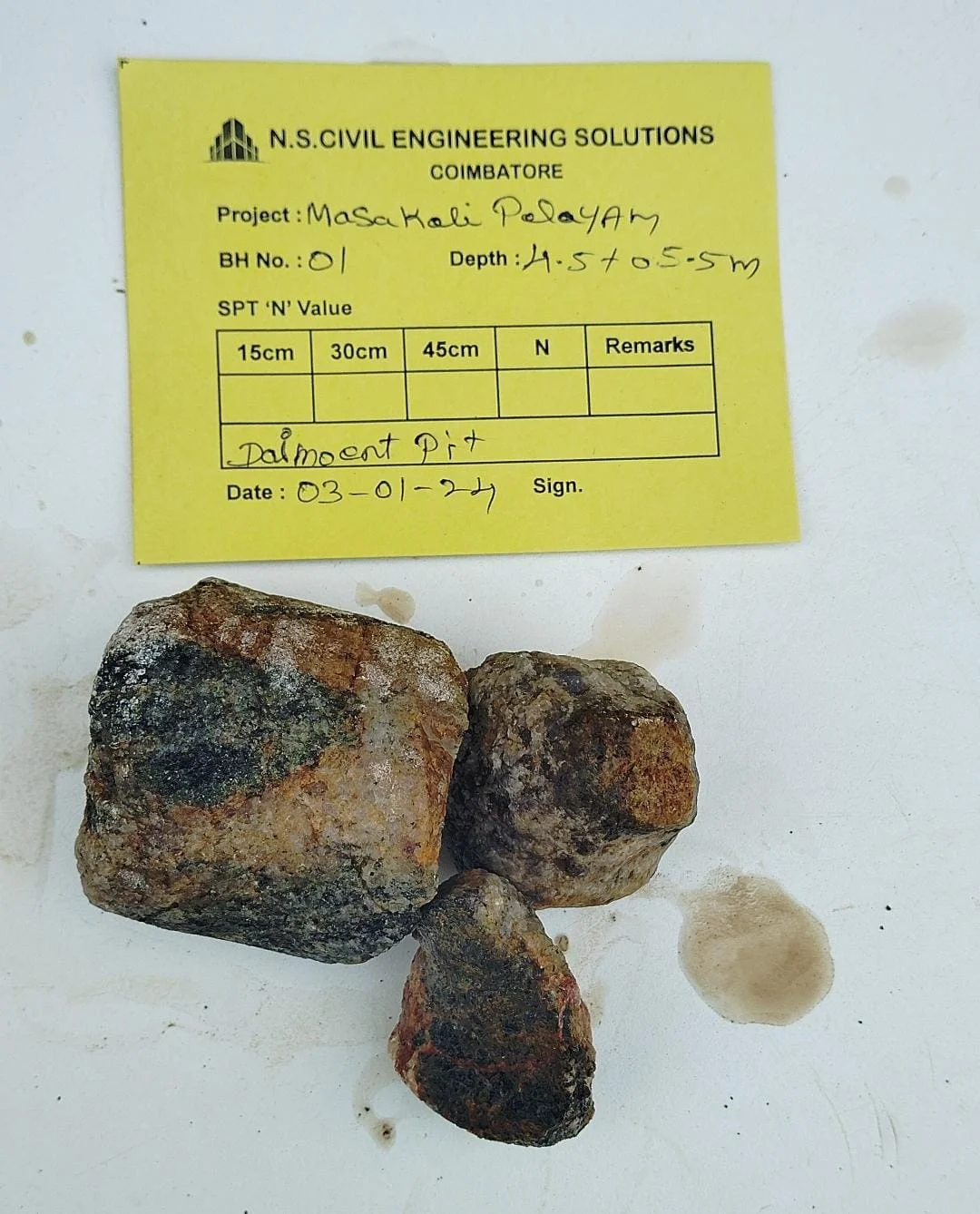 Soil rig in operation with workers