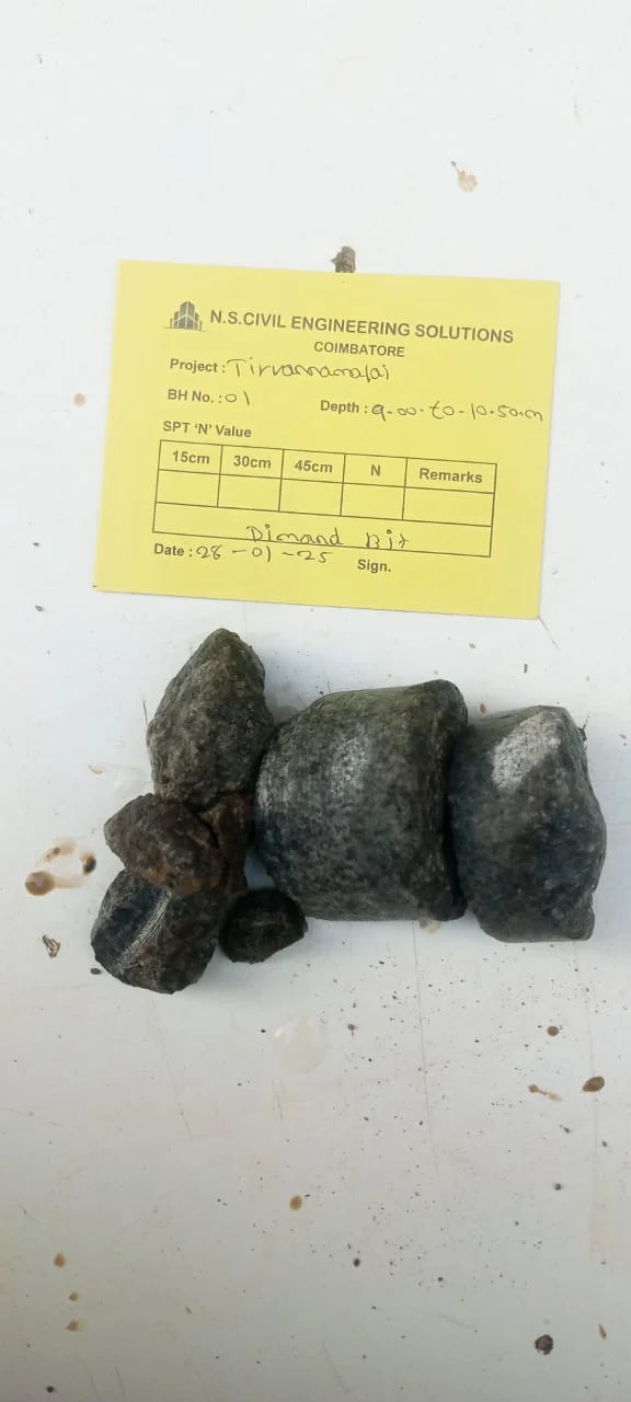 Soil rig in operation with workers