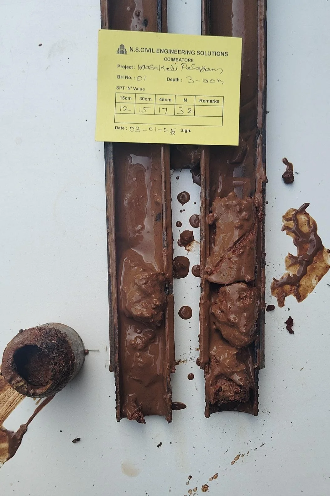 Soil rig in operation with workers