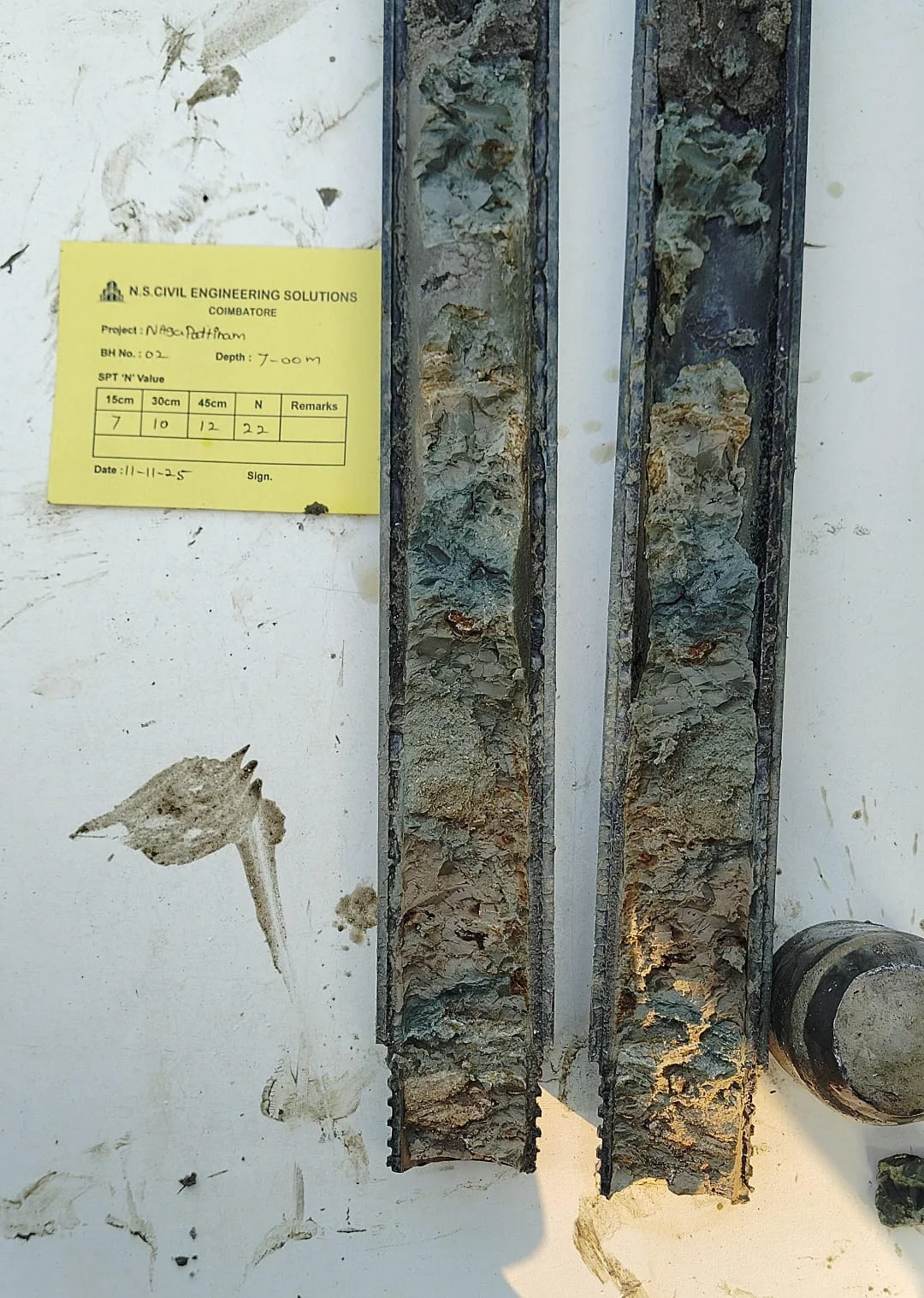 Soil rig in operation with workers