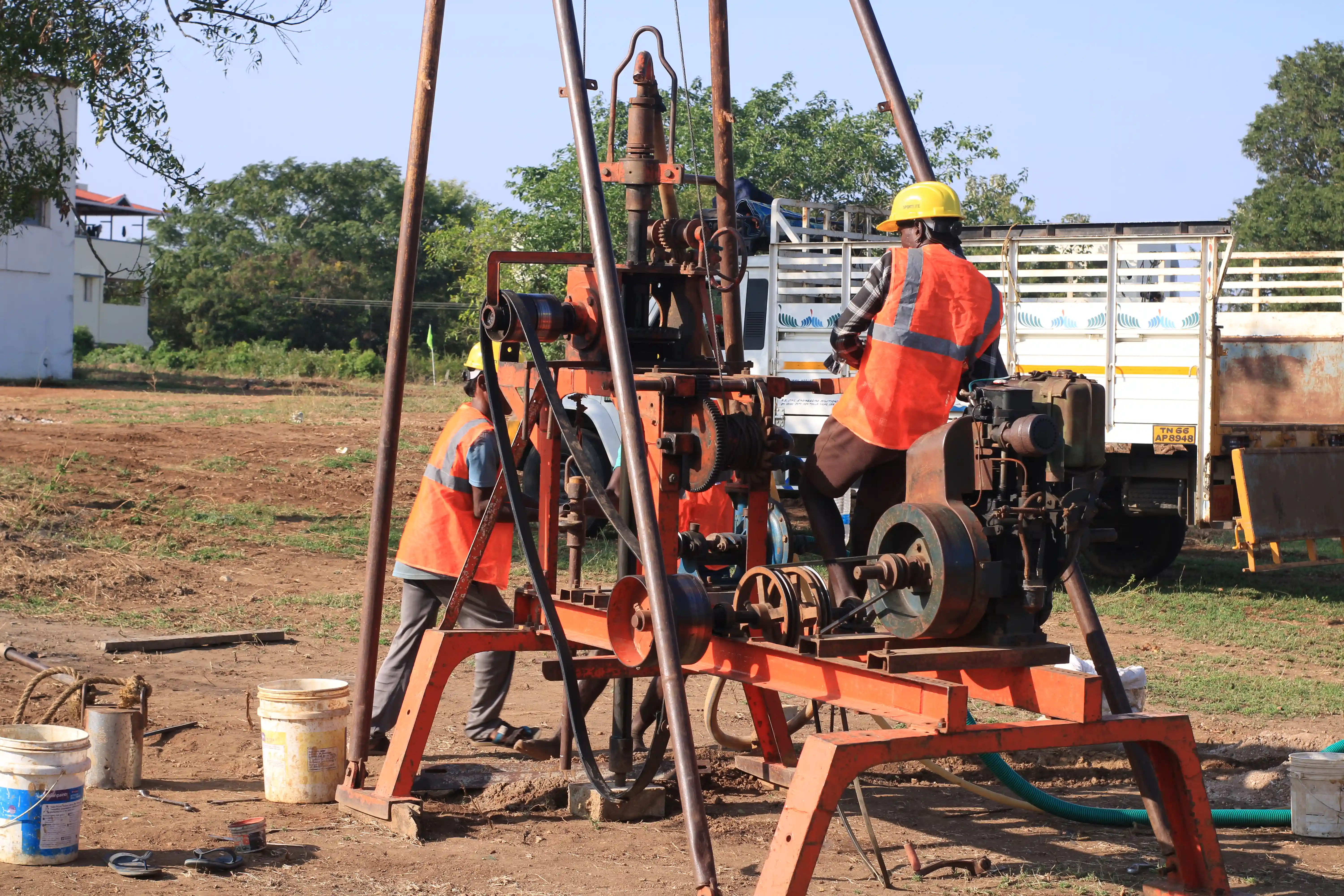 Soil rig in operation with workers