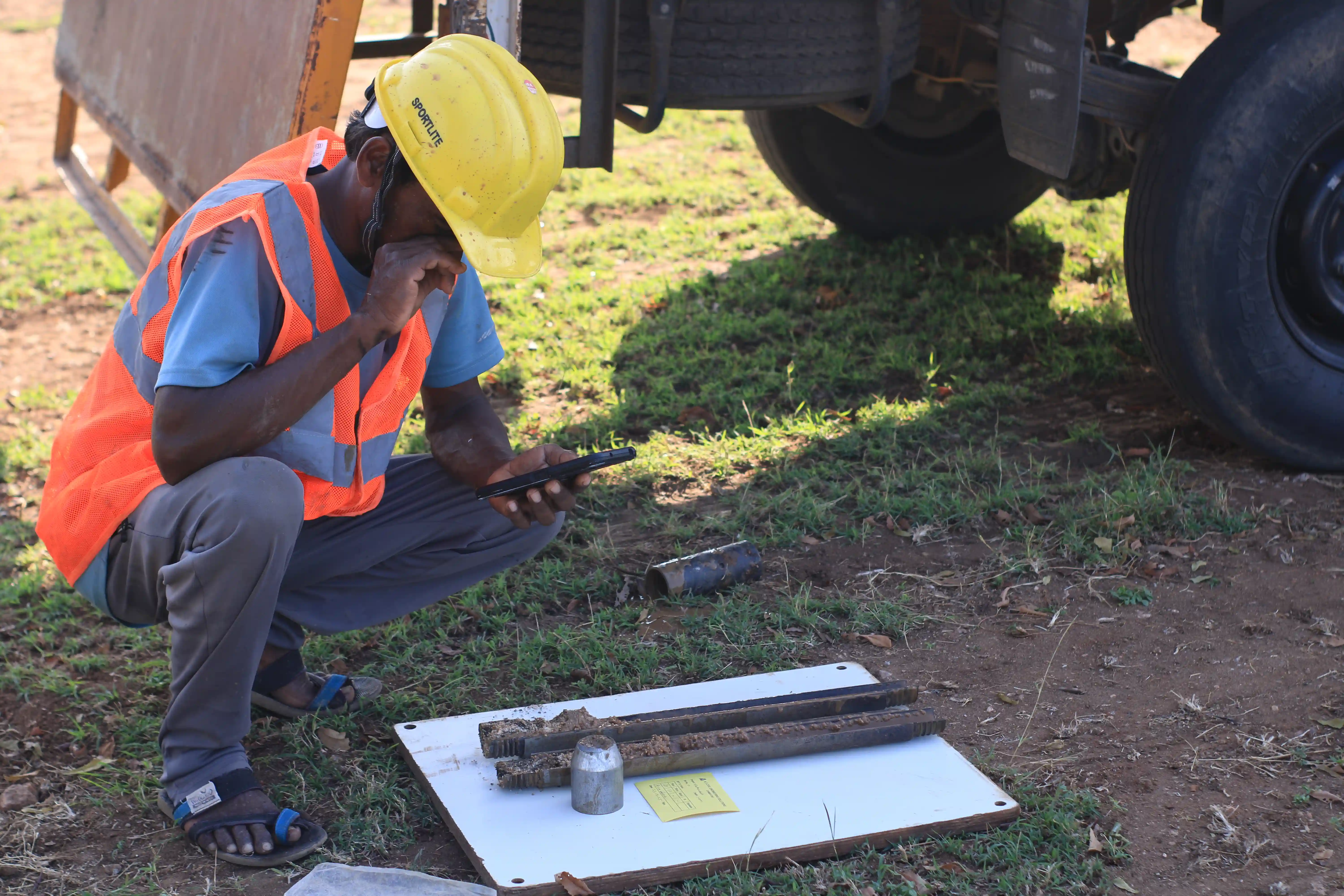 Soil rig in operation with workers