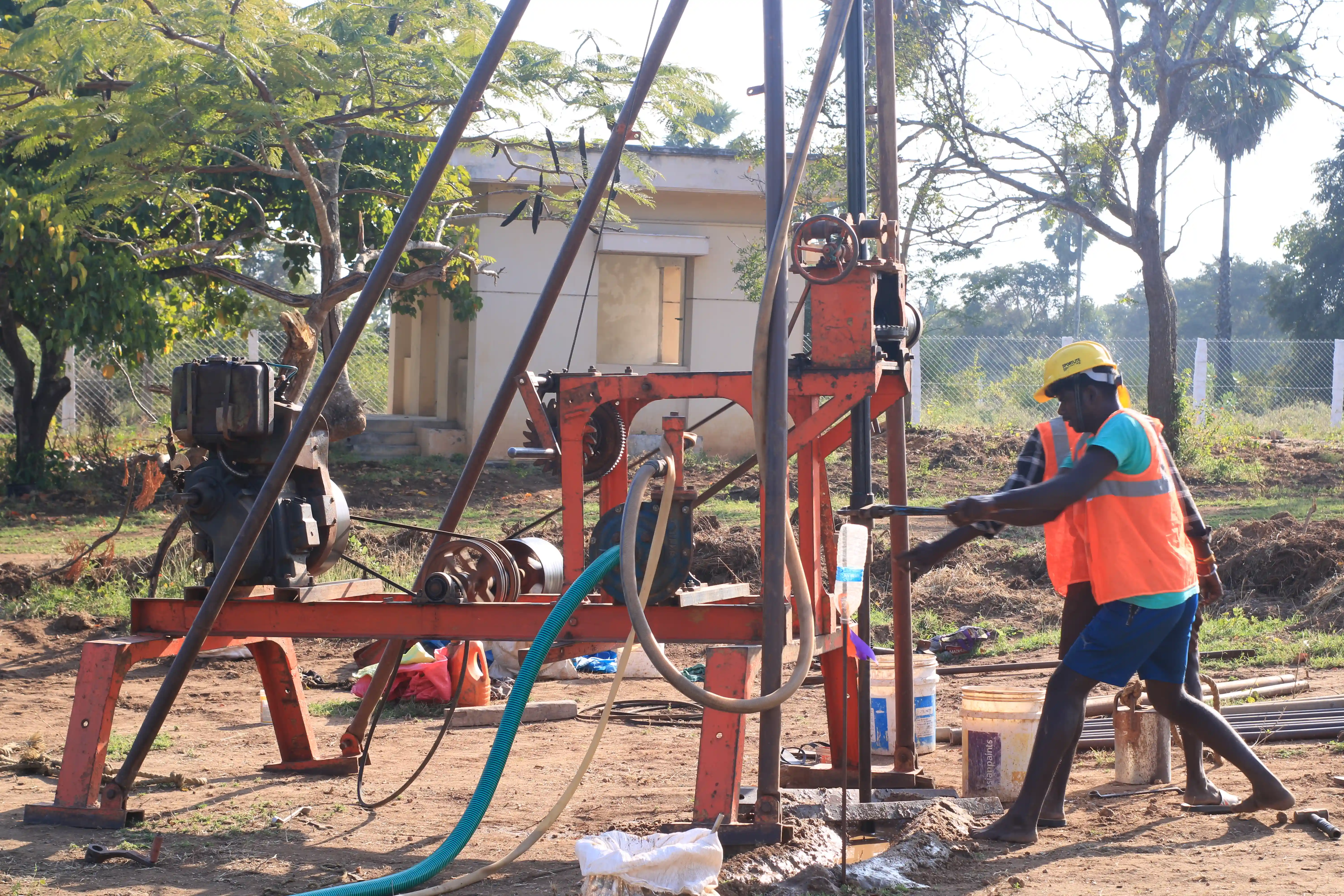 Soil rig in operation with workers