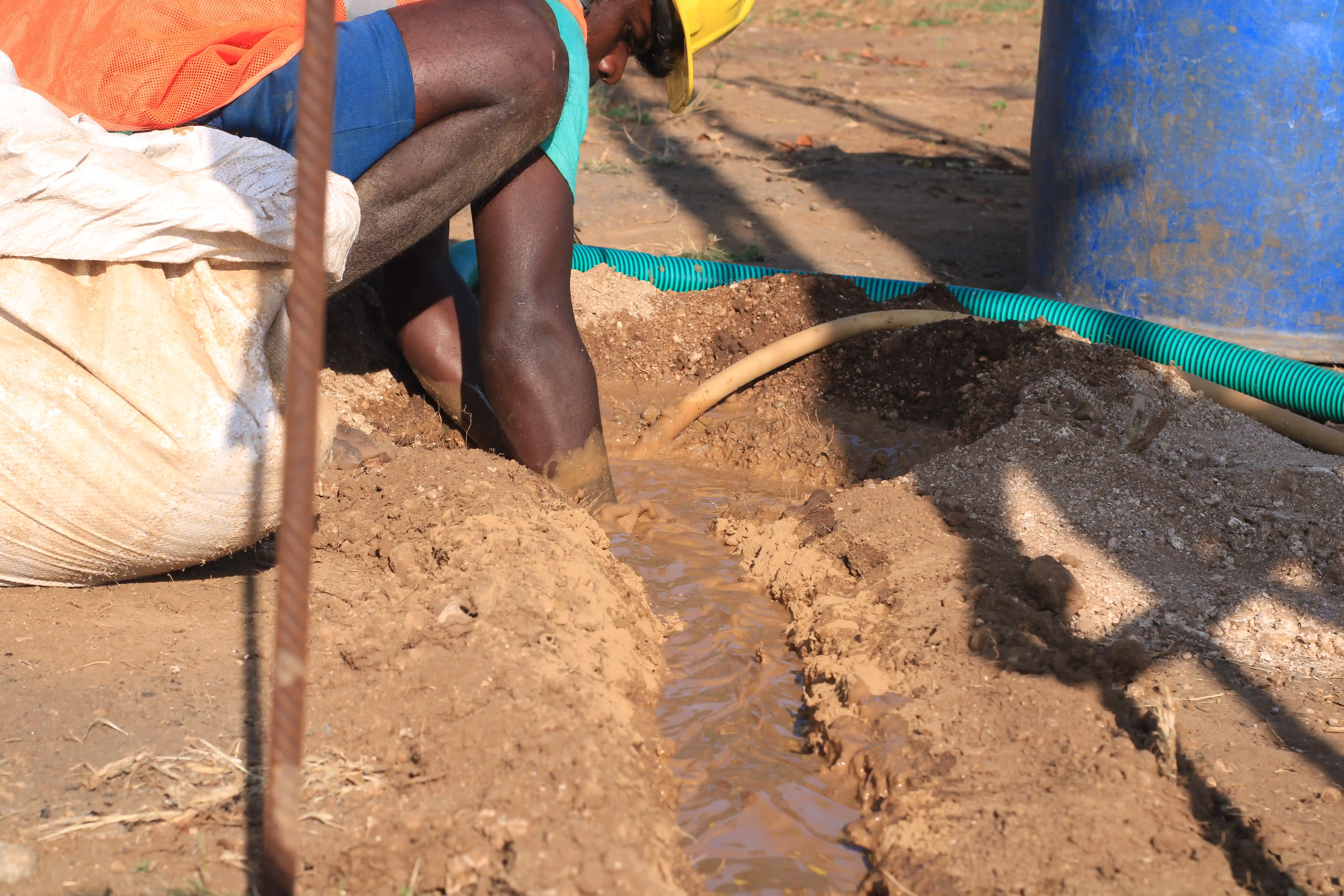 Soil rig in operation with workers
