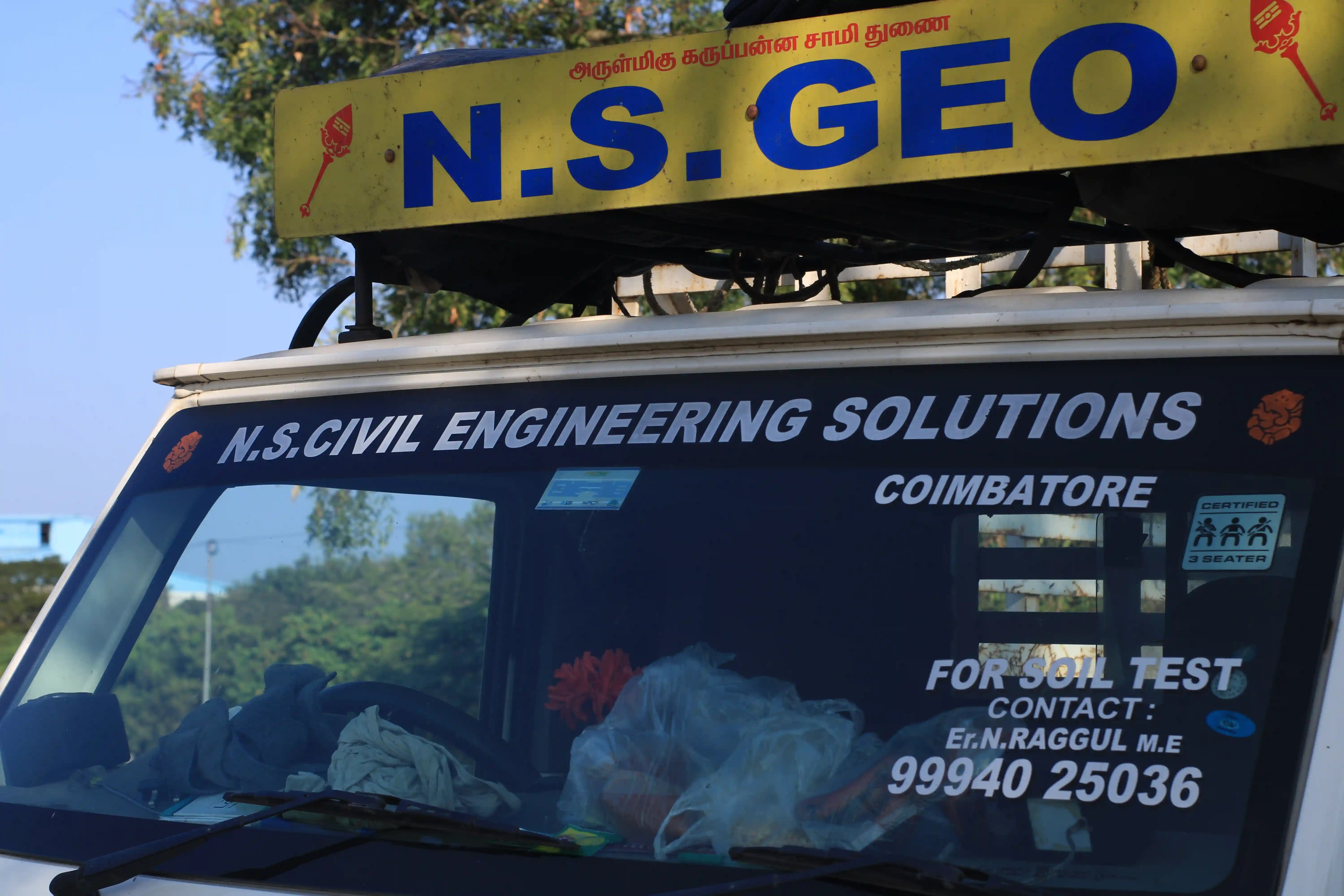 Soil rig in operation with workers