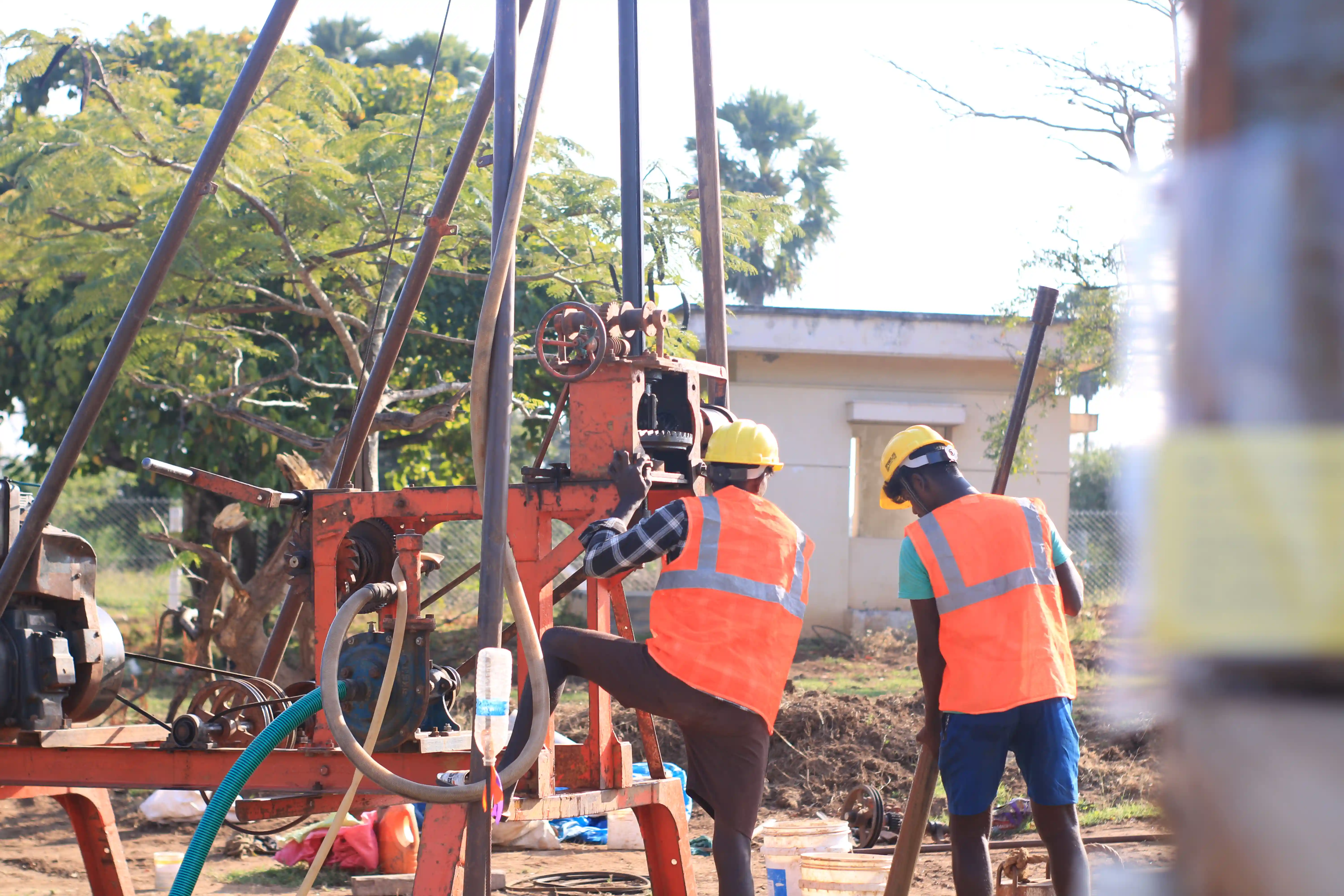 Soil rig in operation with workers