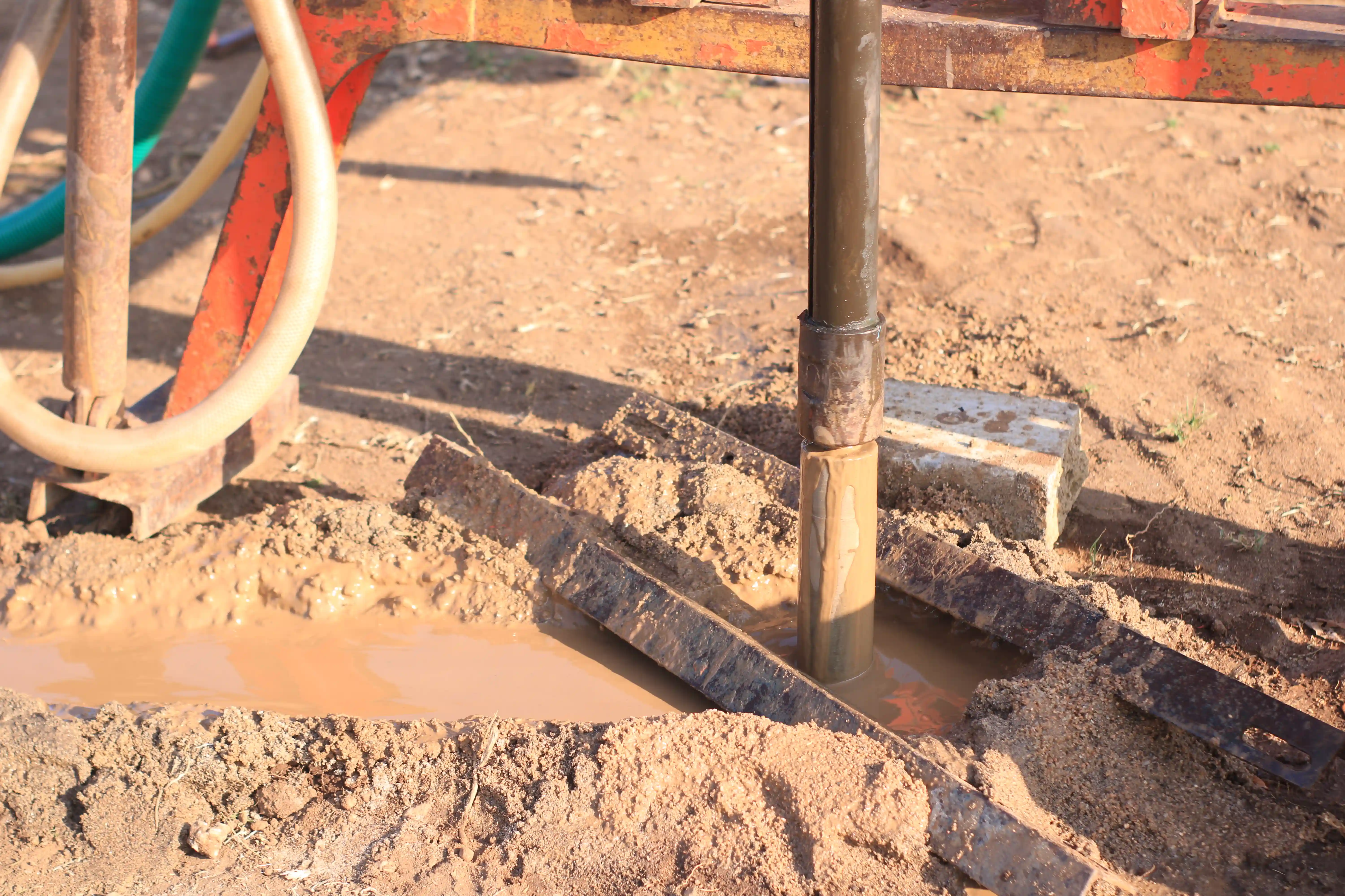 Soil rig in operation with workers