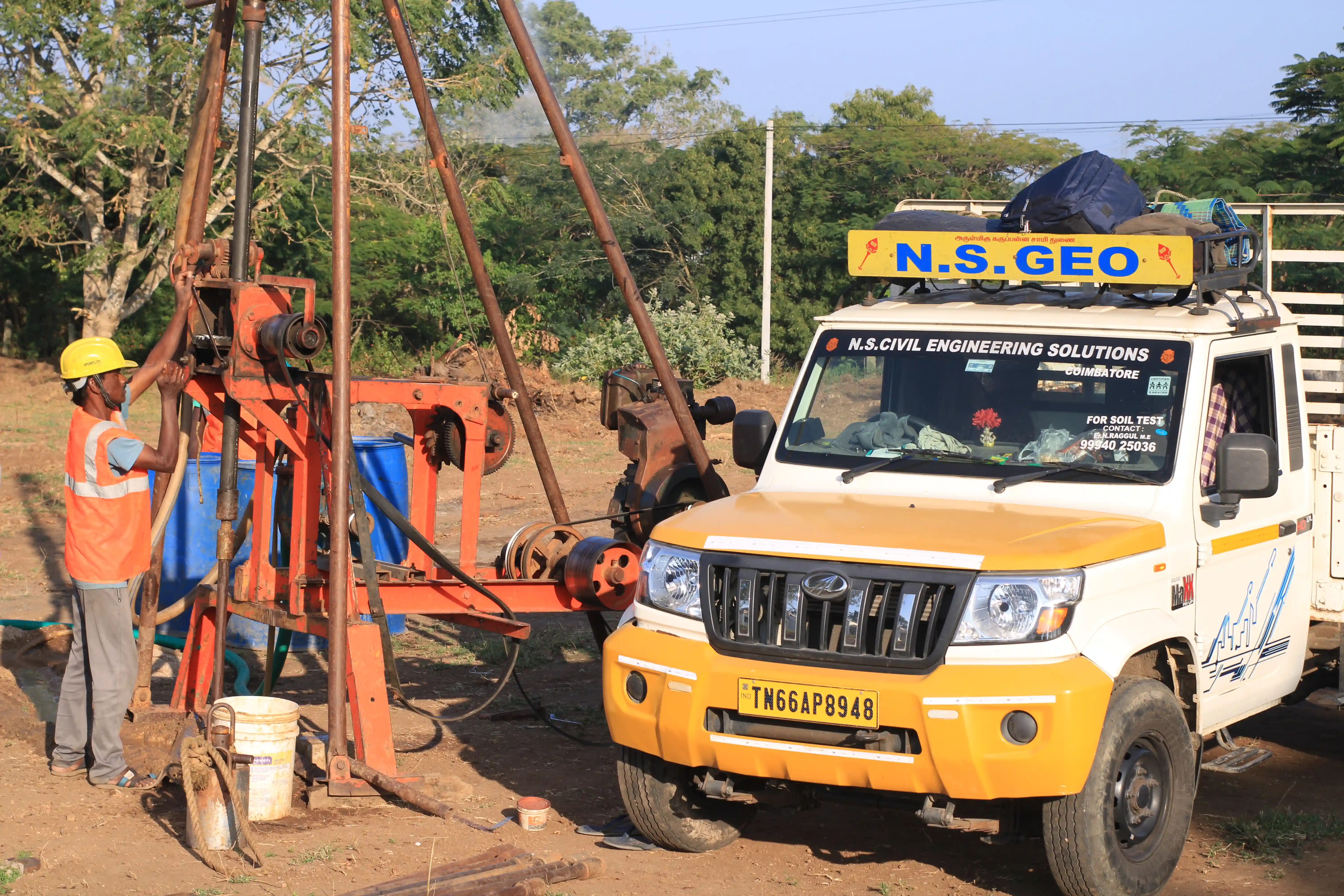 Soil rig in operation with workers