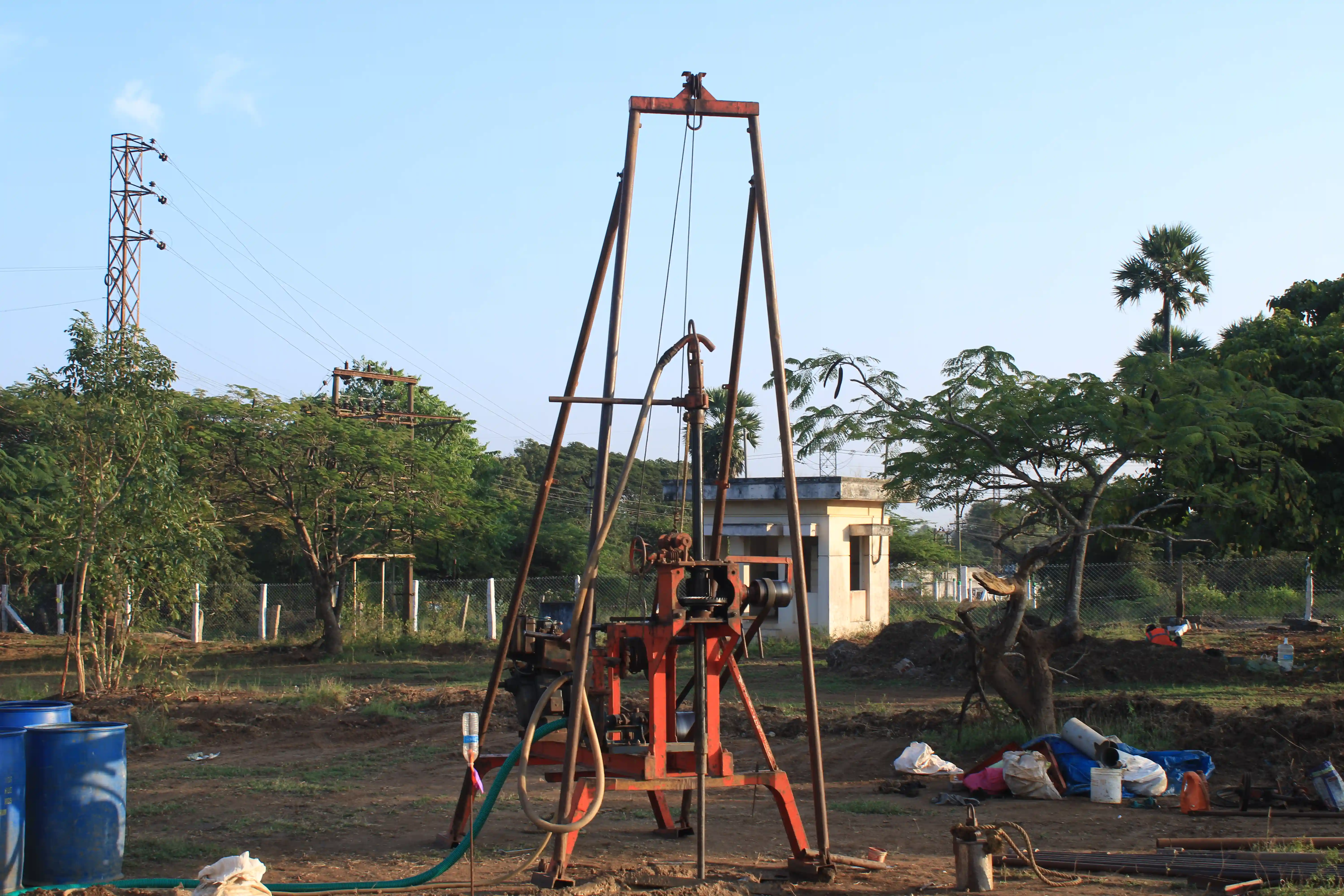 Soil rig in operation with workers