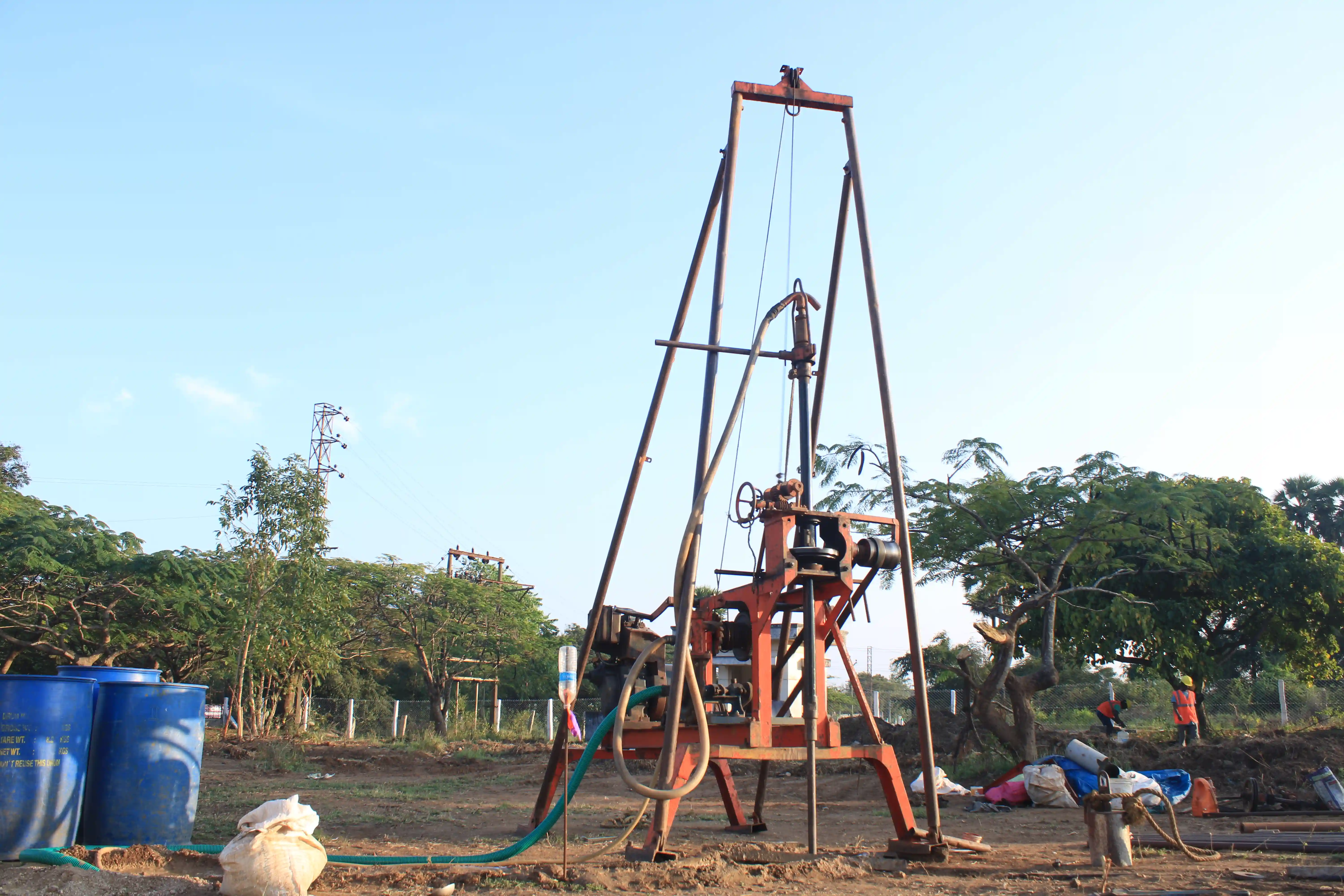 Soil rig in operation with workers