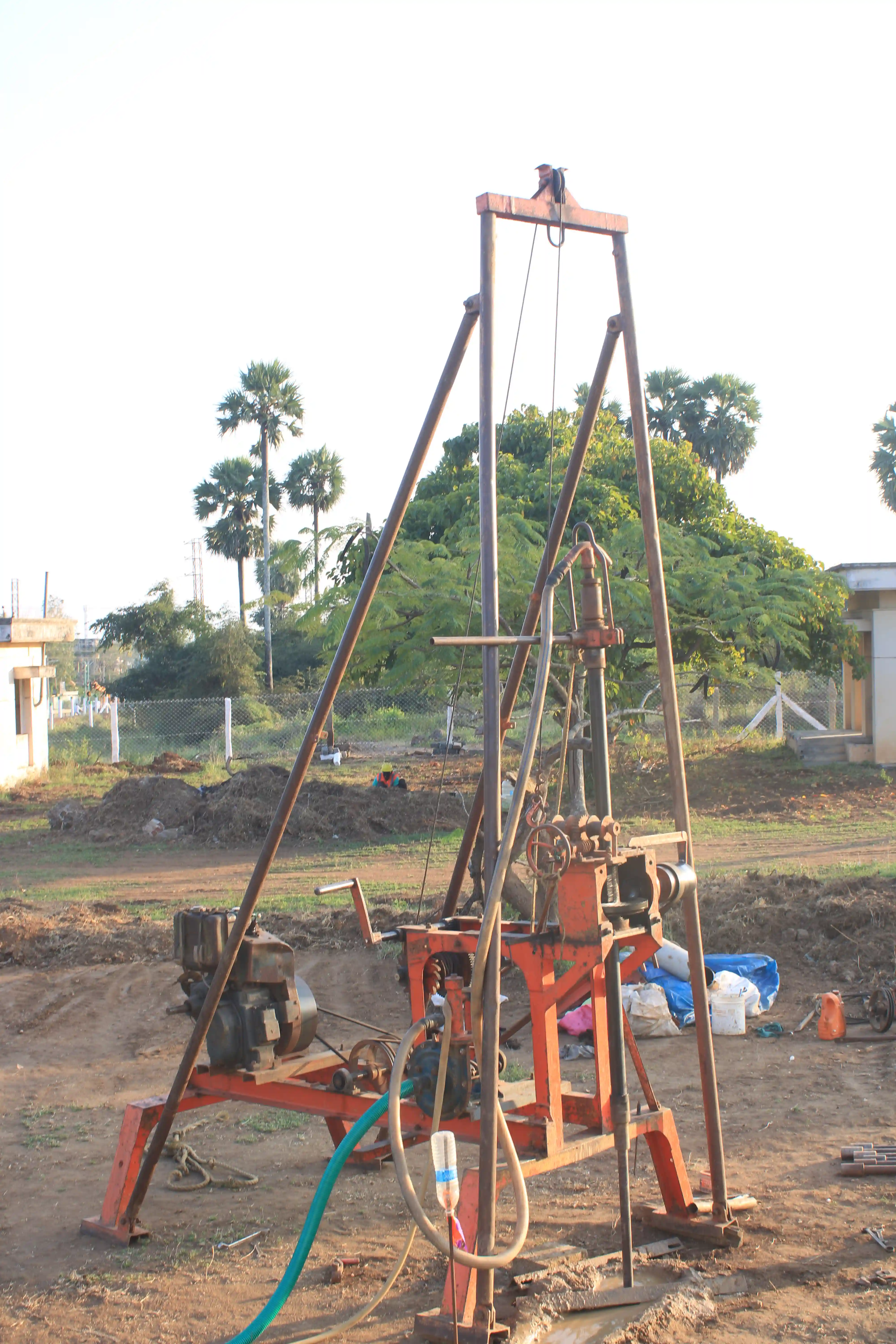 Soil rig in operation with workers