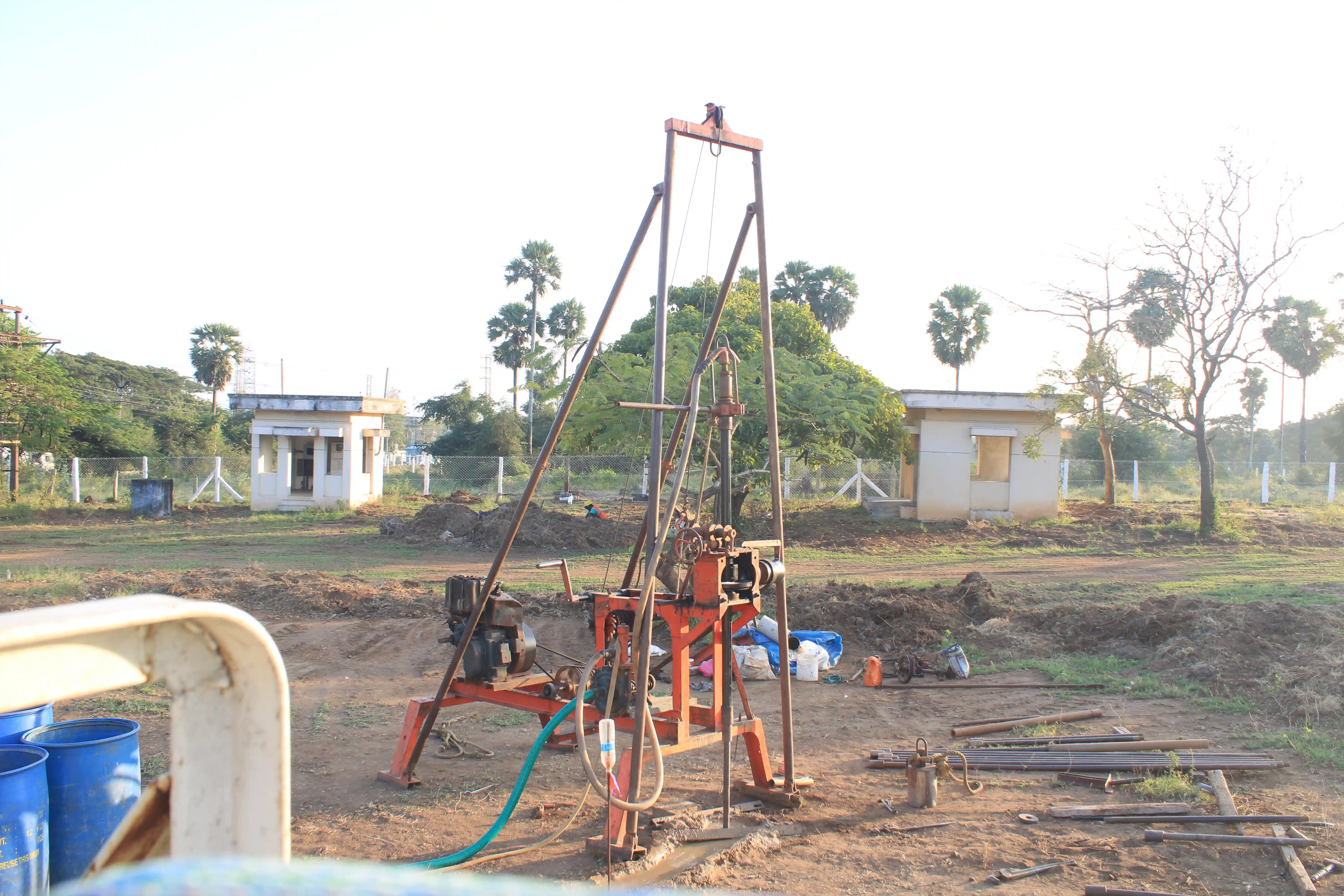 Soil rig in operation with workers