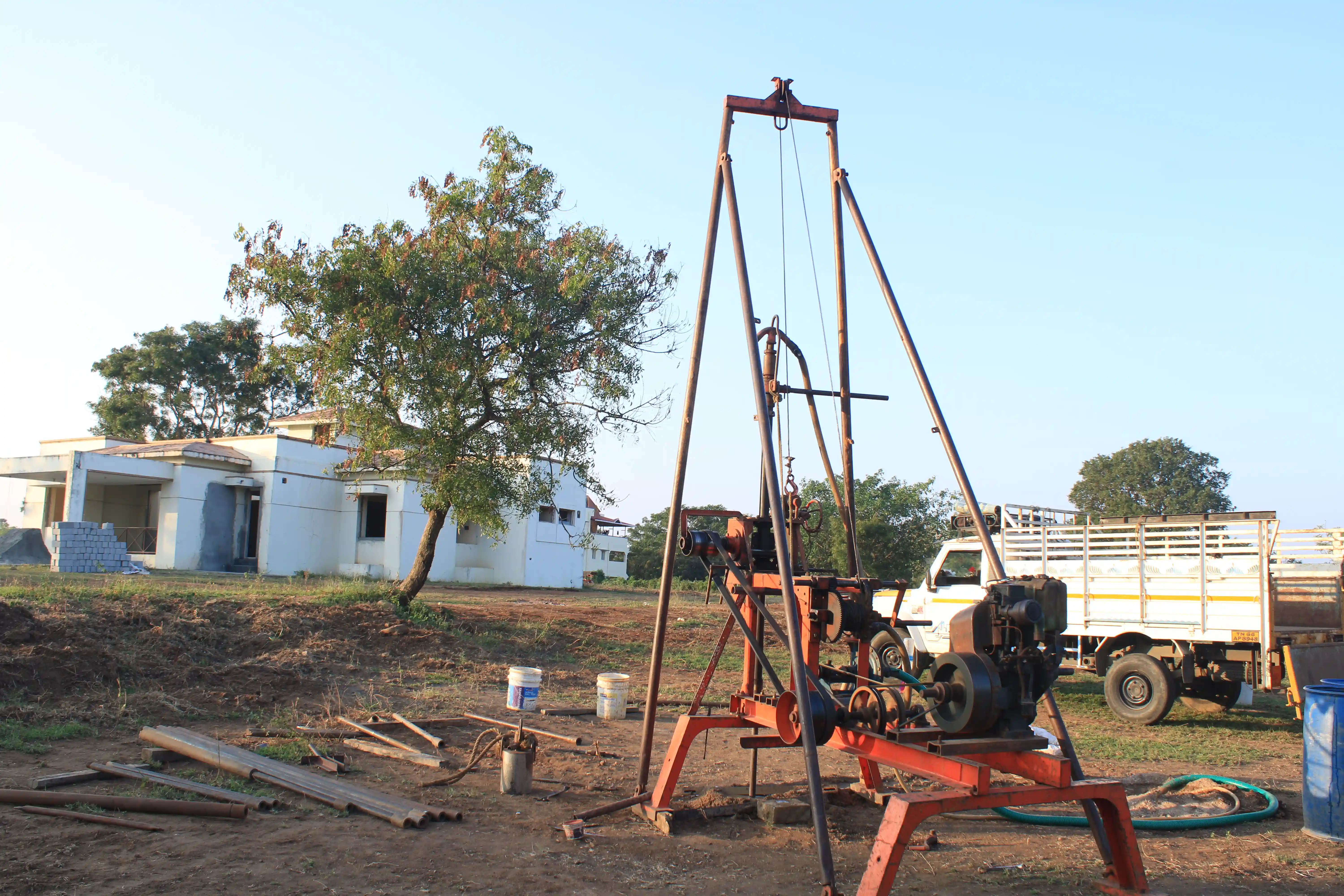 Soil rig in operation with workers