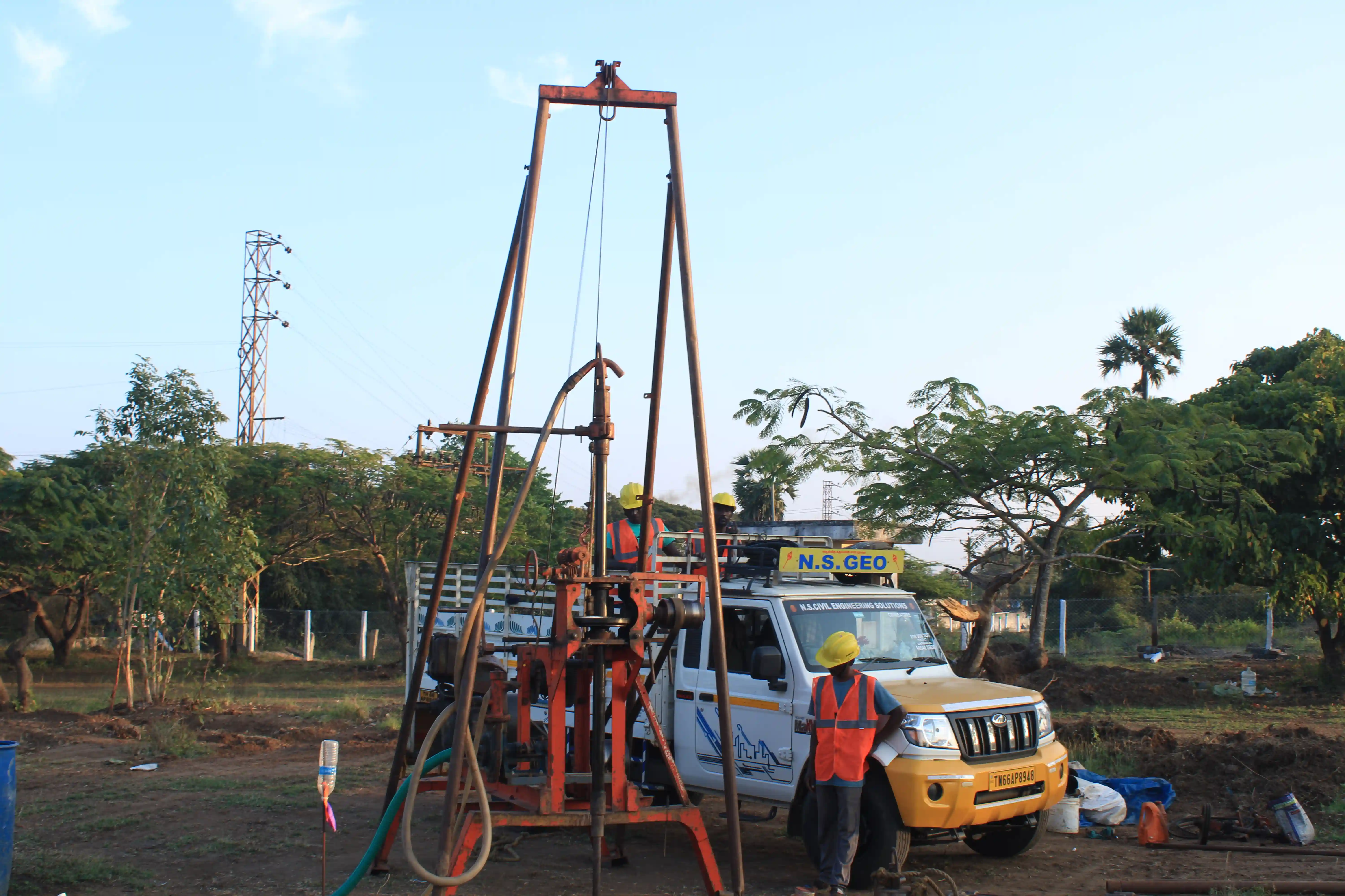 Soil rig in operation with workers
