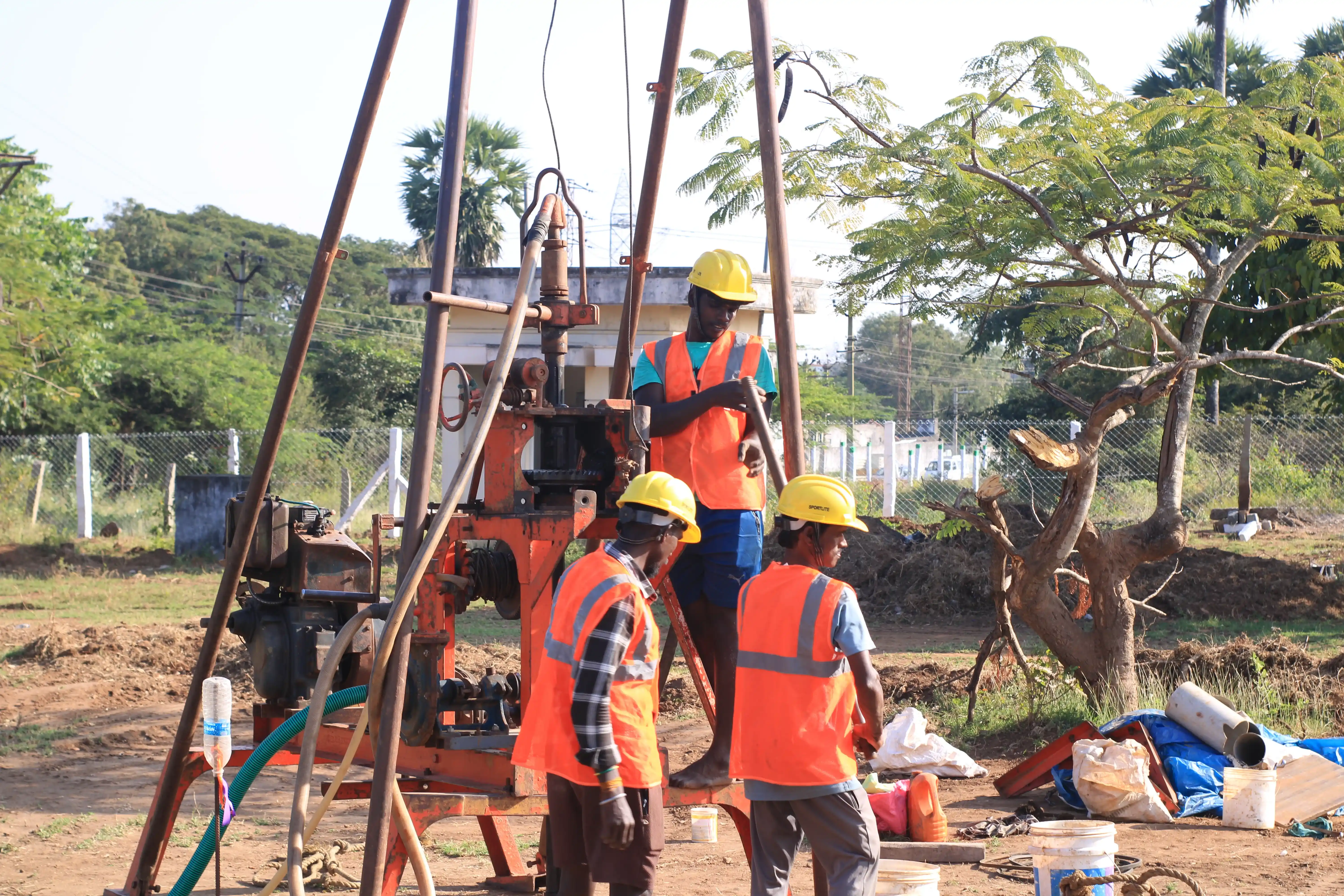 Soil rig in operation with workers