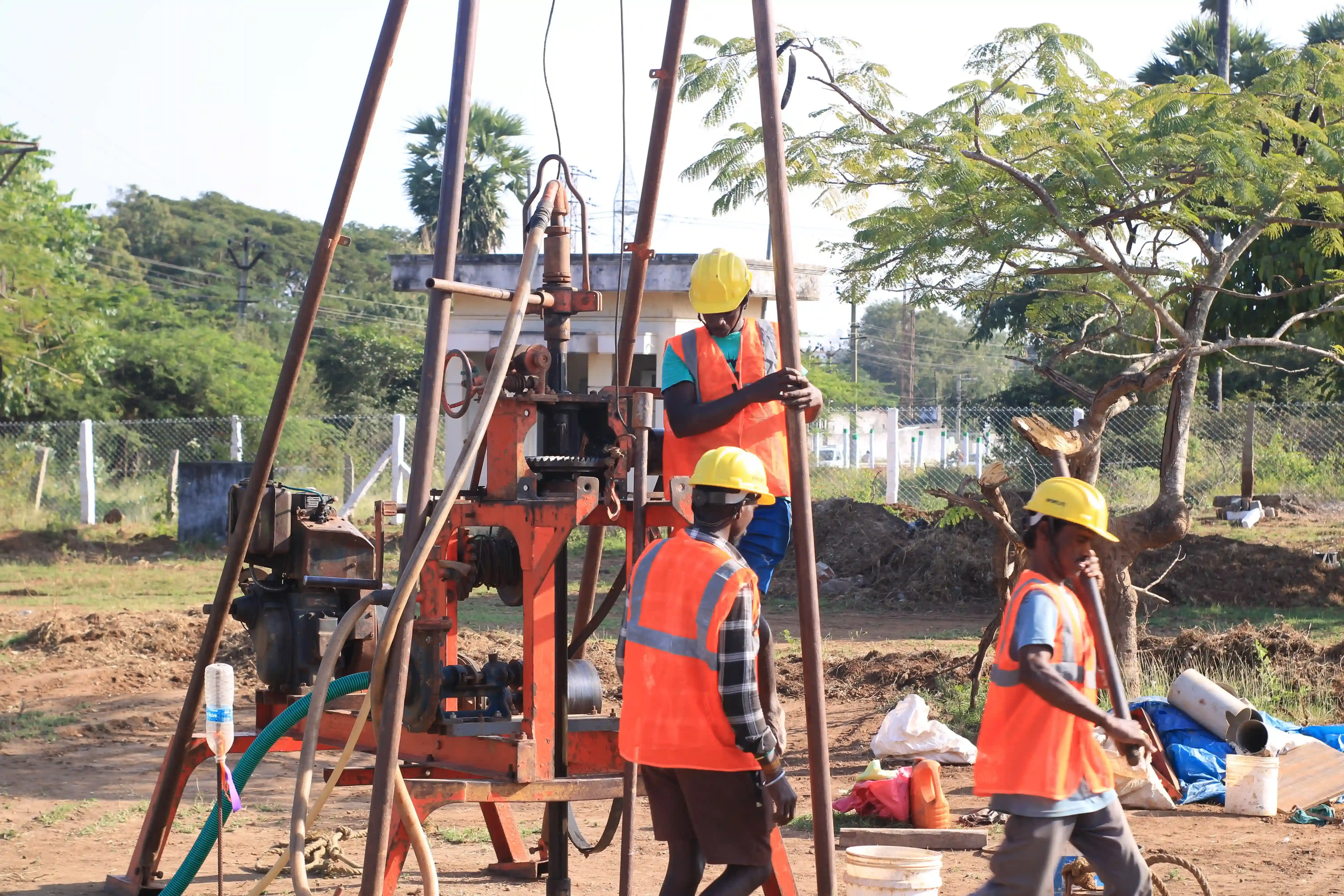 Soil rig in operation with workers