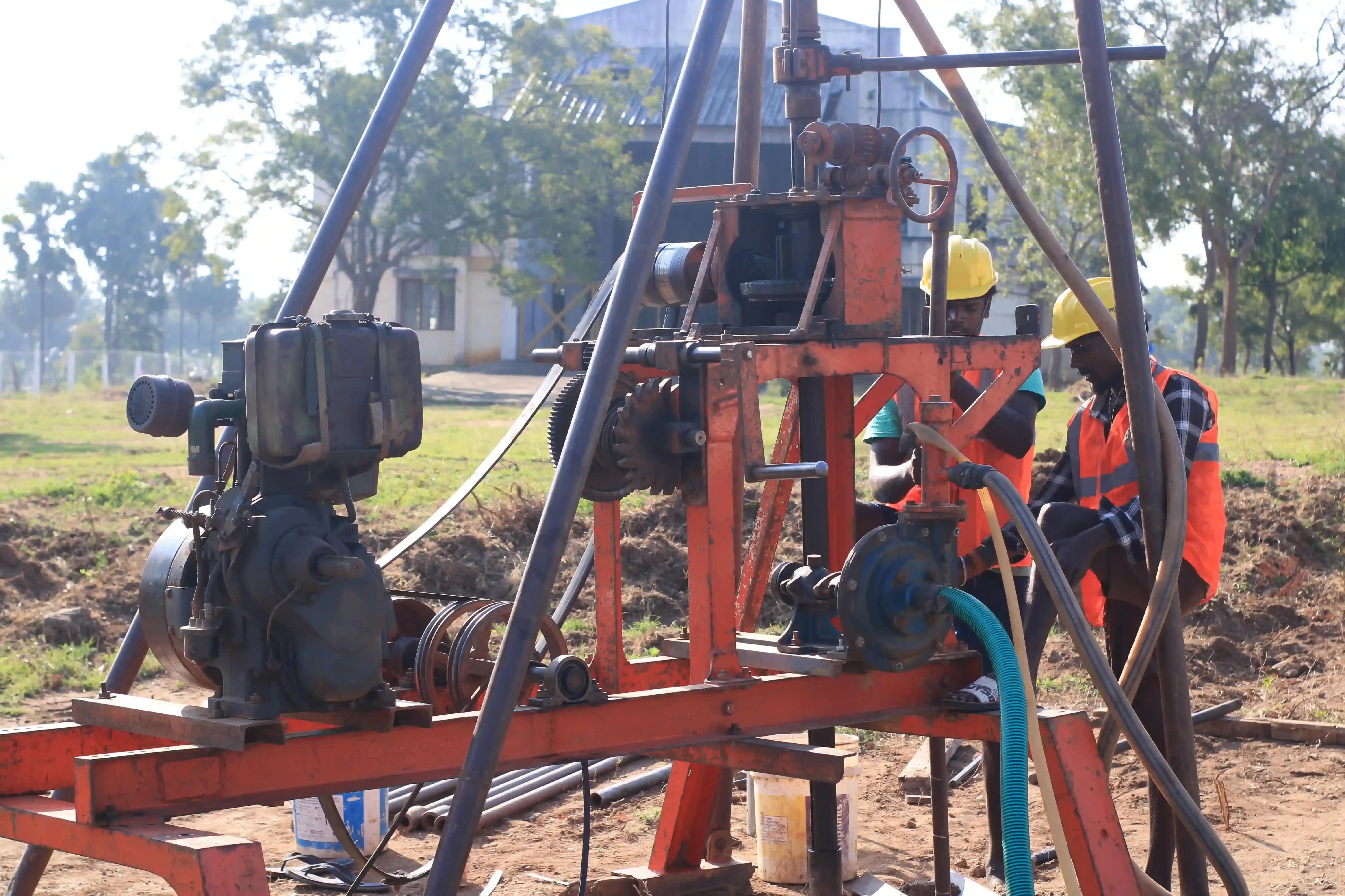 Soil rig in operation with workers