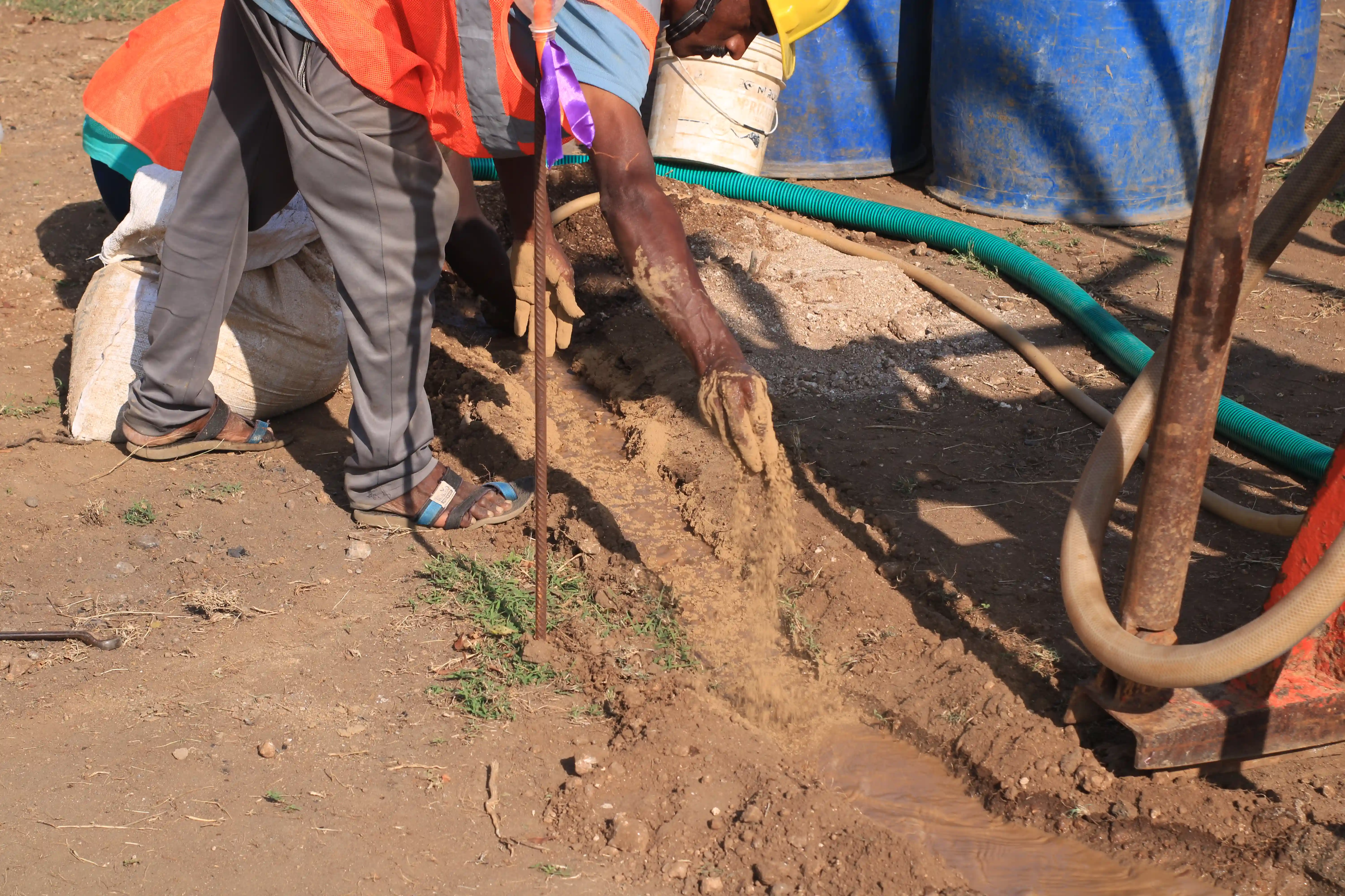Soil rig in operation with workers