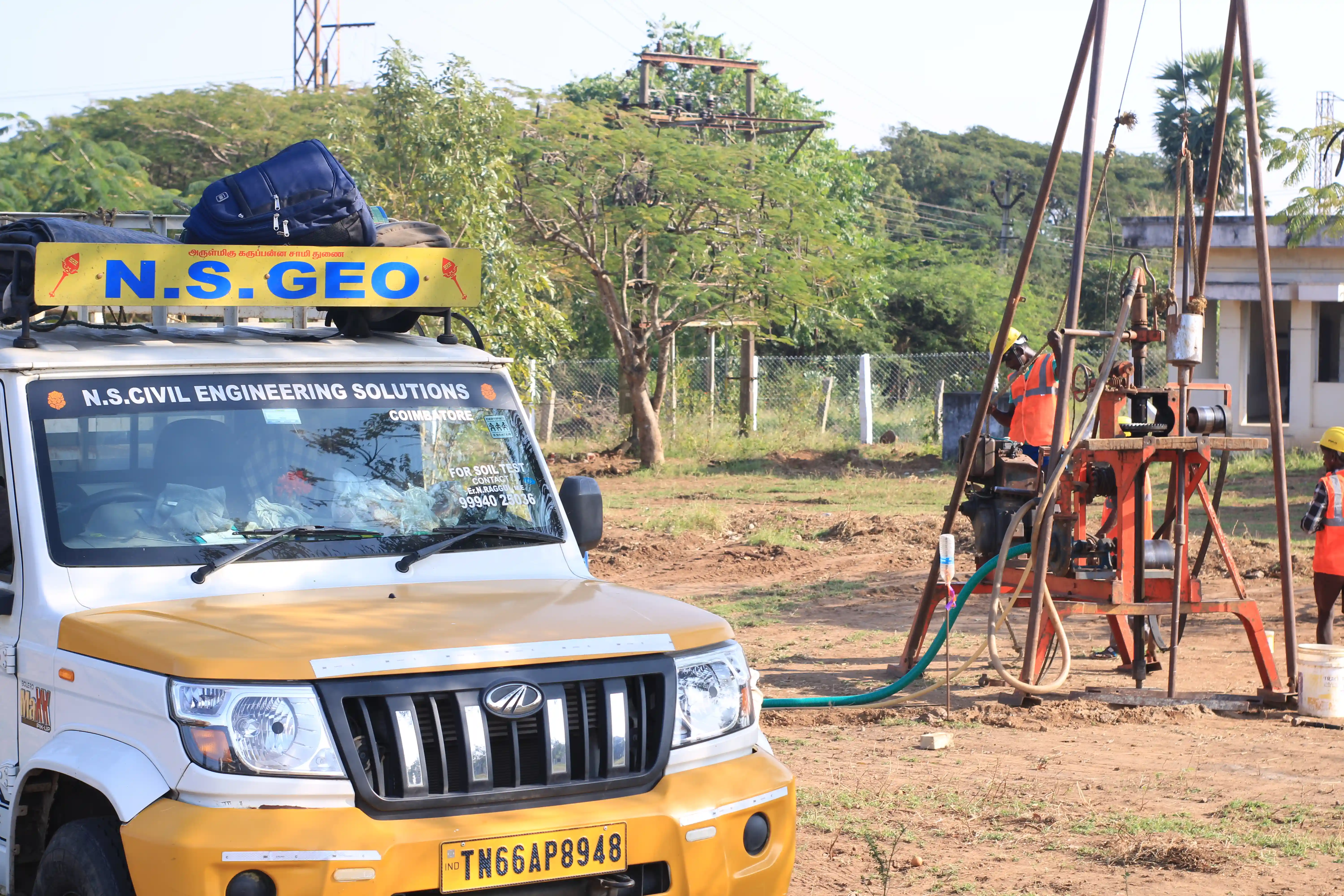 Soil rig in operation with workers
