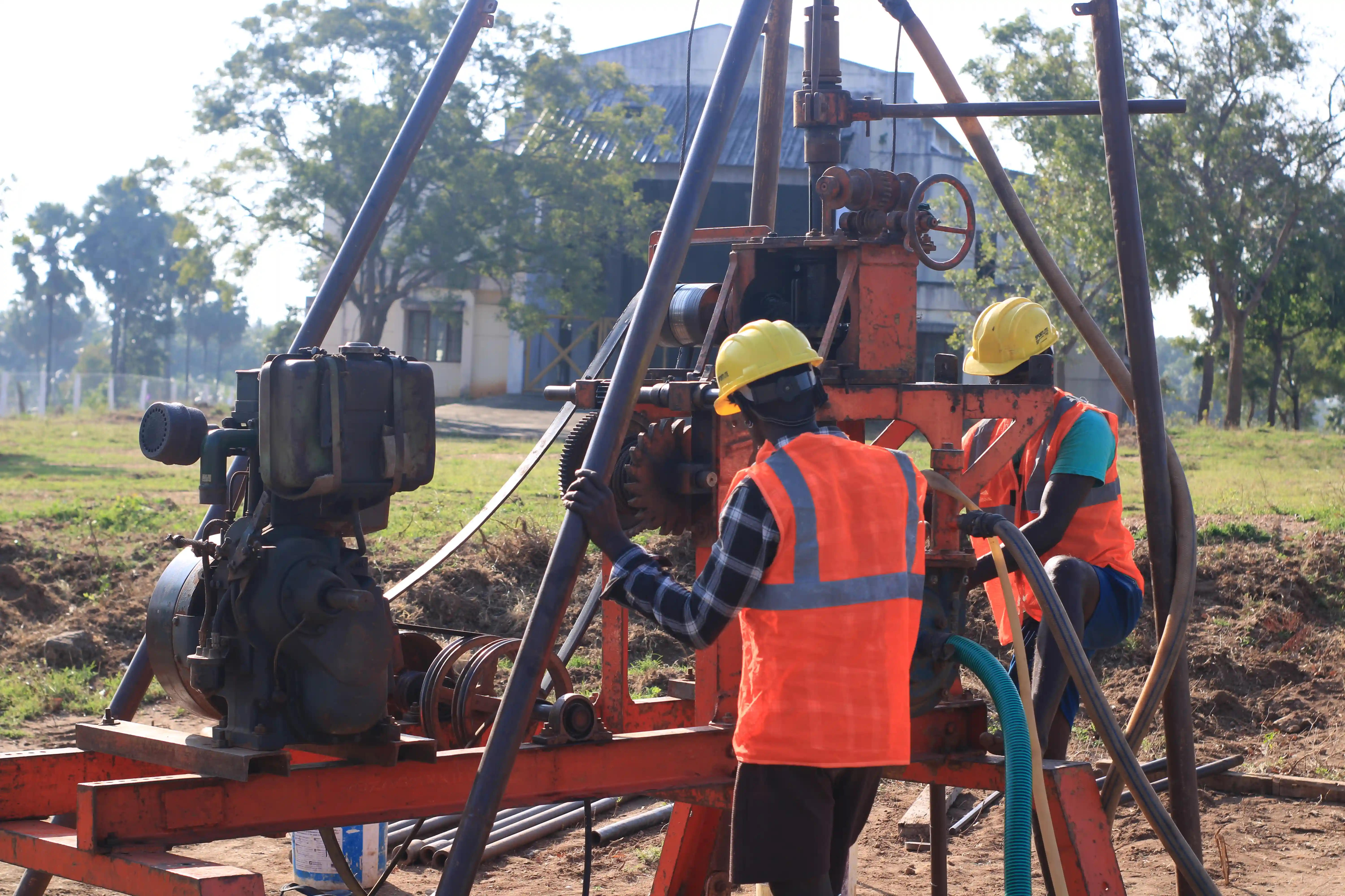 Soil rig in operation with workers
